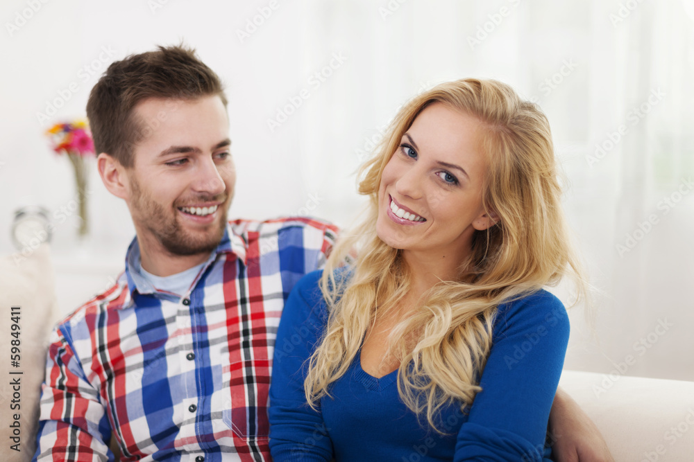 Portrait of smiling couple in living room Portrait of smiling couple in living room