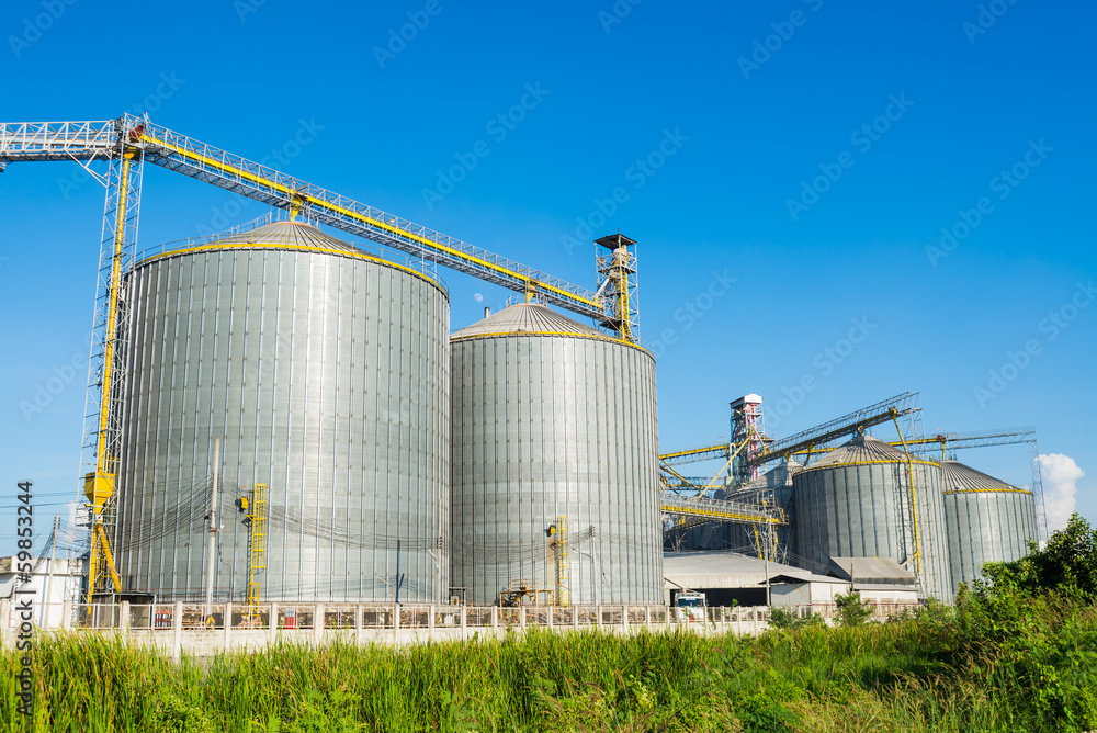 factory manufacture animal feed with blue sky