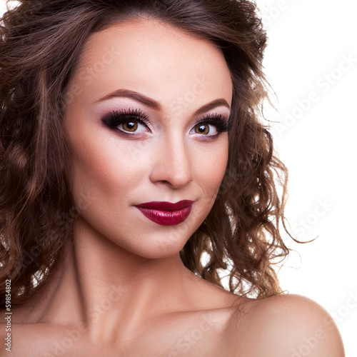 Beautiful girl with professional make up on white background