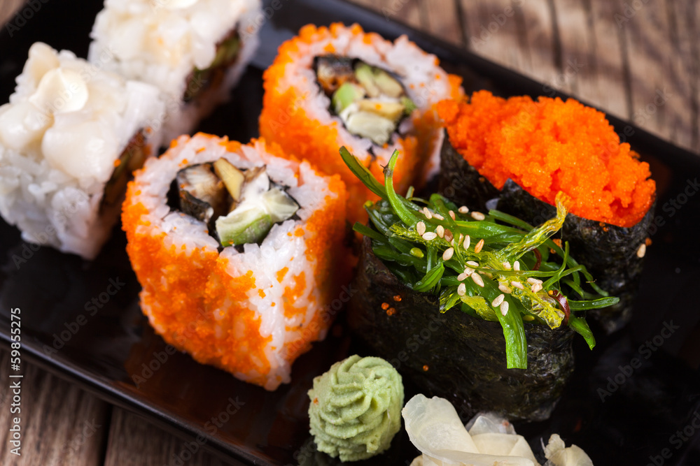 Maki Sushi on wooden background