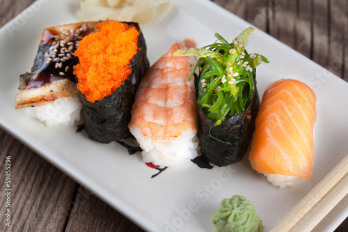 fresh sushi on wooden background