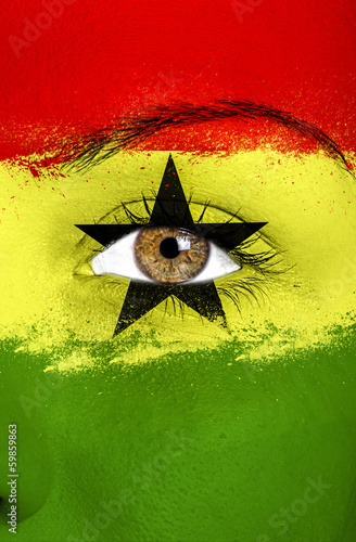 Ghana flag painted over female face