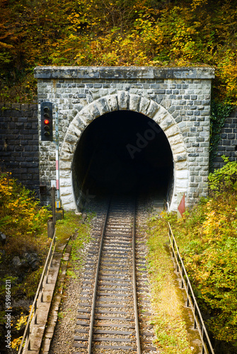 Old brick tunnel in the mountains in autumn