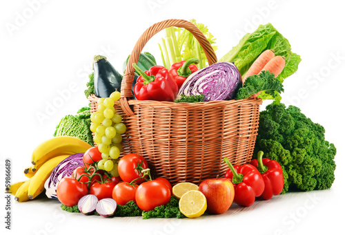 Wicker basket with assorted organic vegetables and fruits  isola