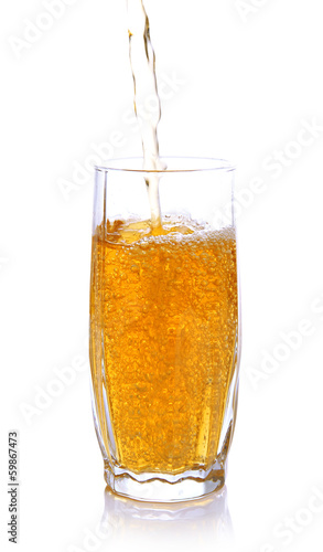 Wallpaper Mural Juice pouring into glass isolated on white Torontodigital.ca