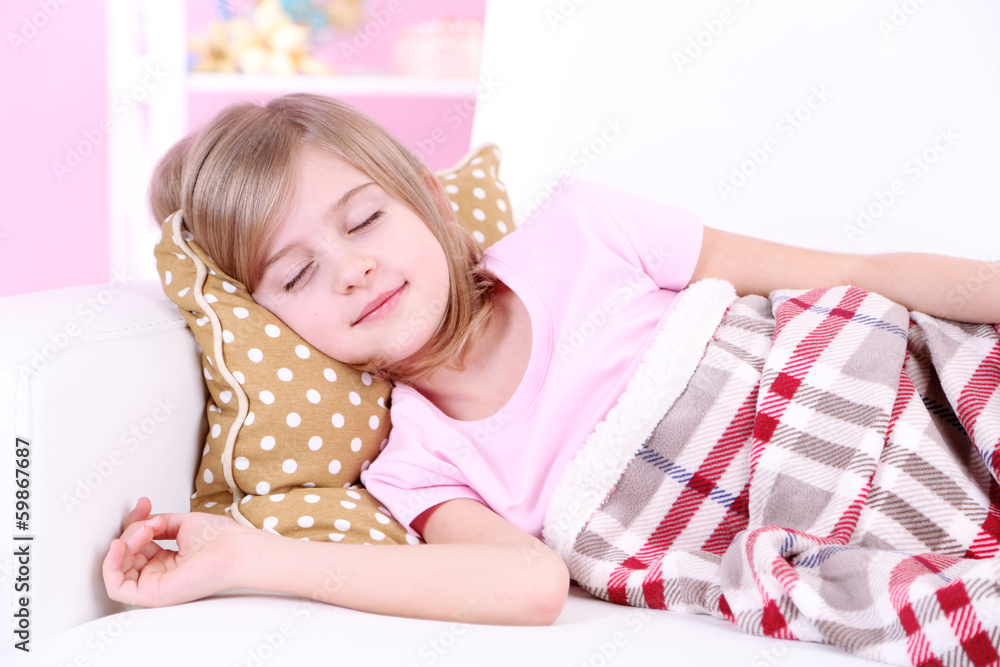 Little girl sleeping on sofa in room Stock Photo Adobe Stock