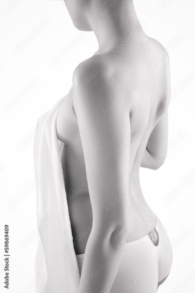 Naklejka premium Young nude woman with towel on white