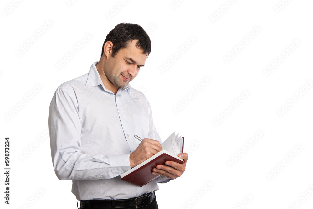 Happy Employee writes notes in notebook Happy Employee writes notes in notebook