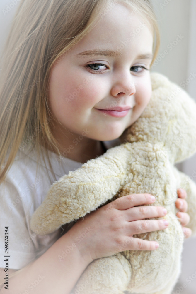 beautiful little girl with a favorite toy beautiful little girl with a favorite toy