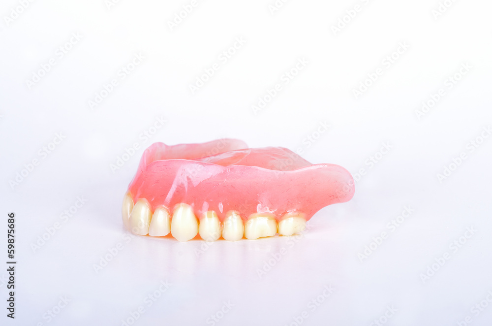 Obraz premium False teeth in glass
