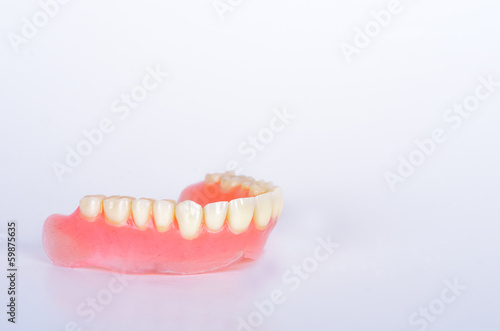 False teeth in glass