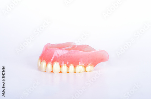 False teeth in glass