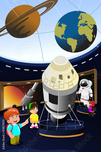 Kids on a field trip to a planetarium