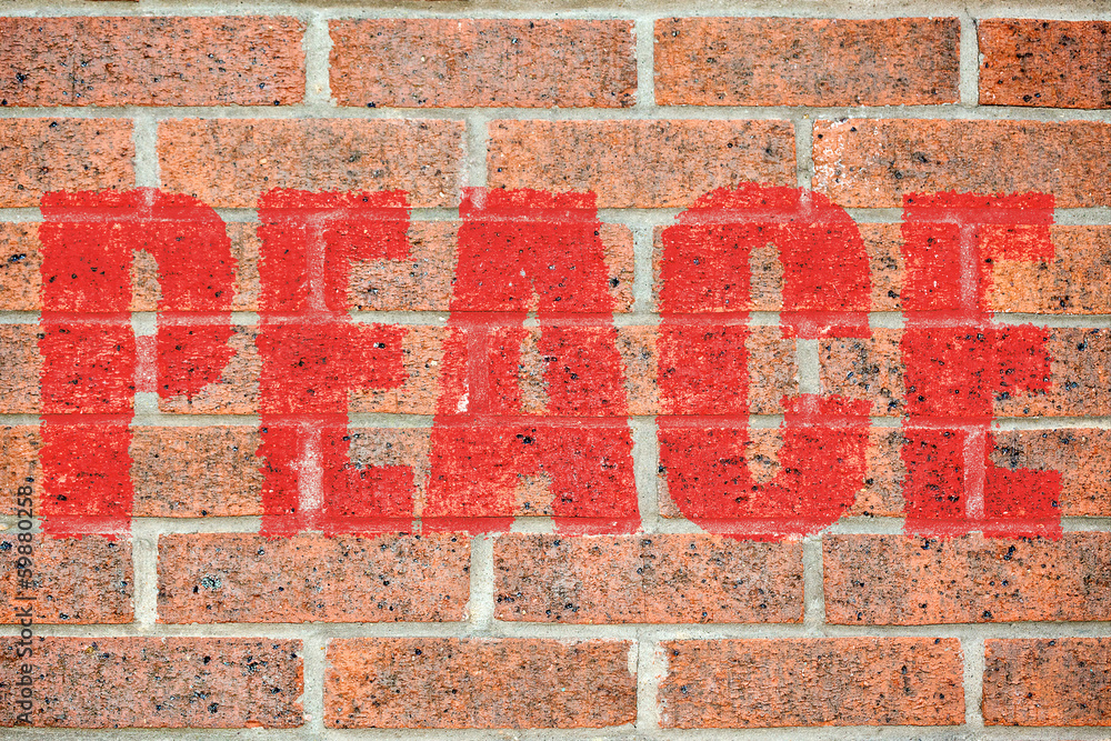 Old brick wall texture with PEACE inscription Old brick wall texture with PEACE inscription