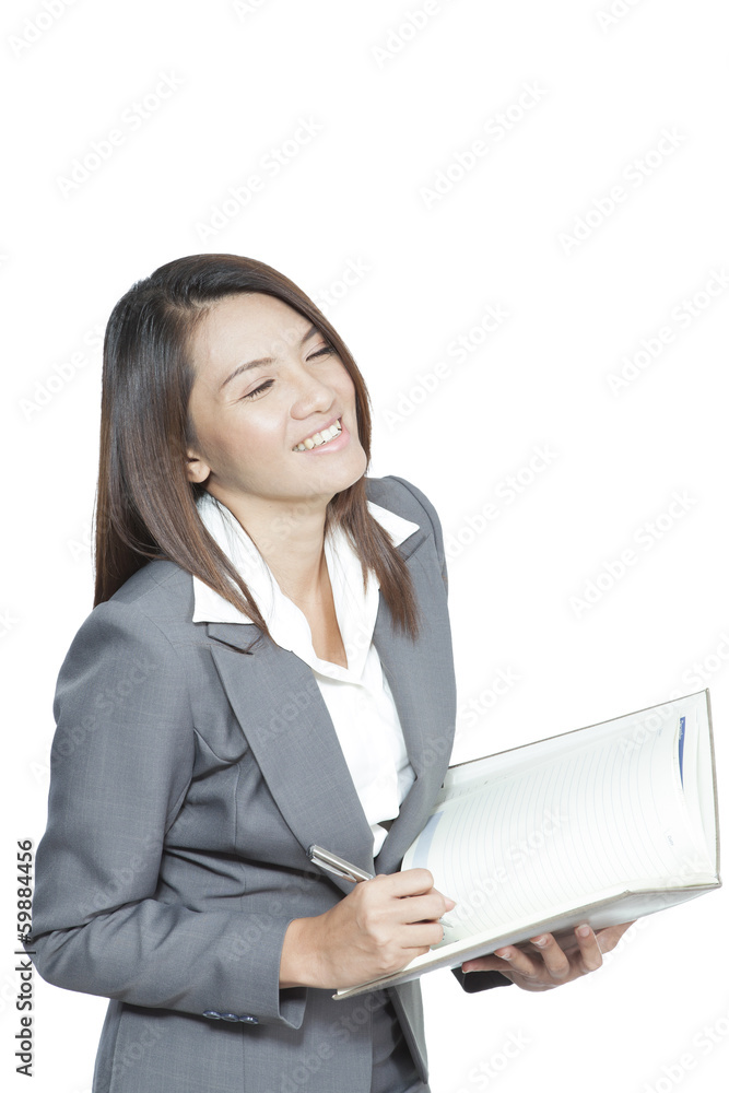 Business woman Asian attractive standing using a pen writing Business woman Asian attractive standing using a pen writing