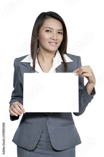 Young Asian business woman attractive brunetee showing blank sig