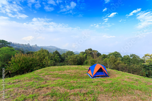 Camping tent on mountain with blue sky