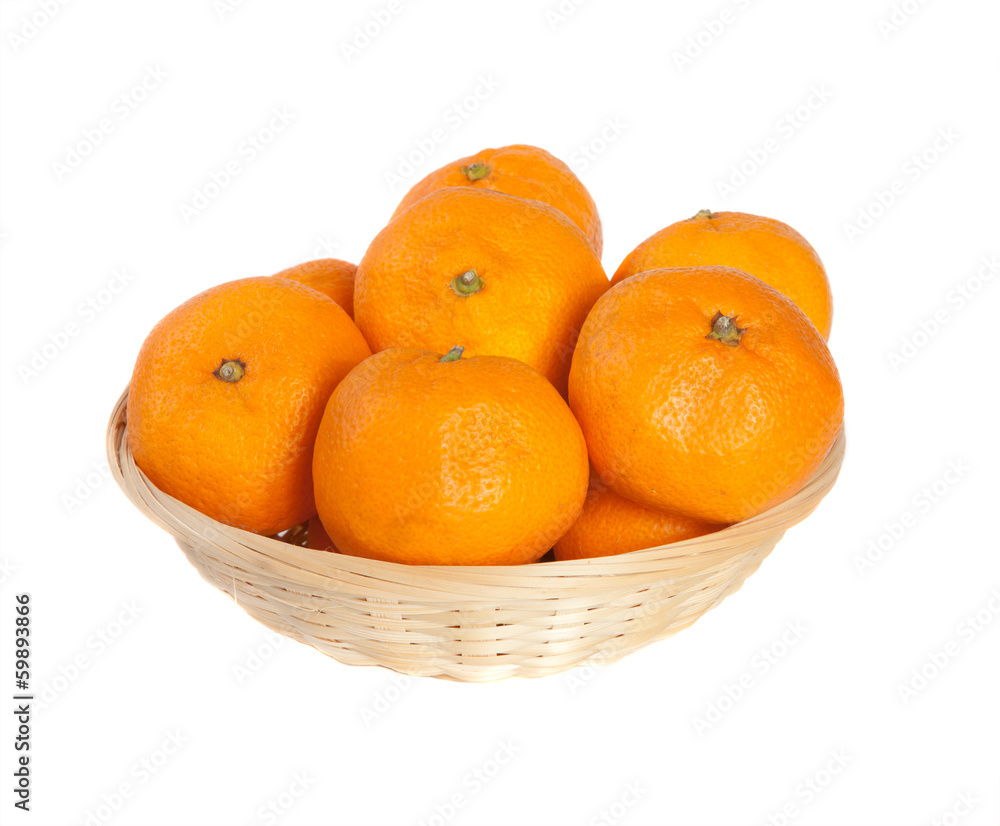 tangerinesin a wicker basketon a white background tangerinesin a wicker basketon a white background
