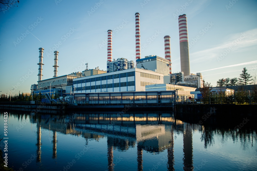 Naklejka premium Electricity power plant near a river