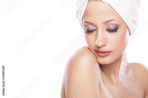 portrait of beautiful serene woman with the towel on her head