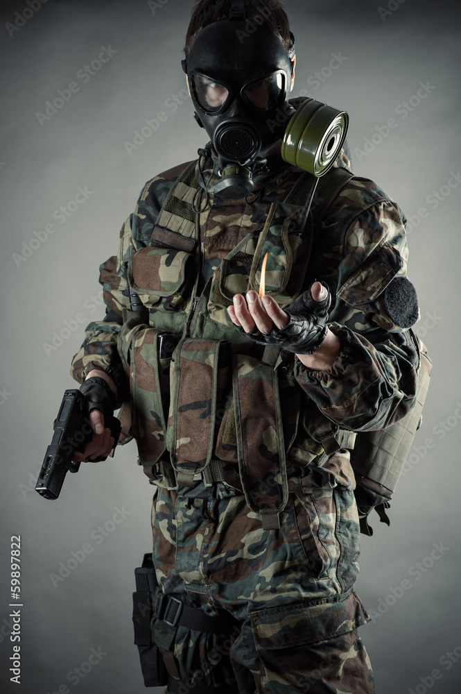 man in uniform with a gun in hands man in uniform with a gun in hands