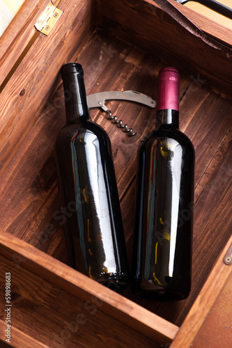 Wood case with bottles of wine