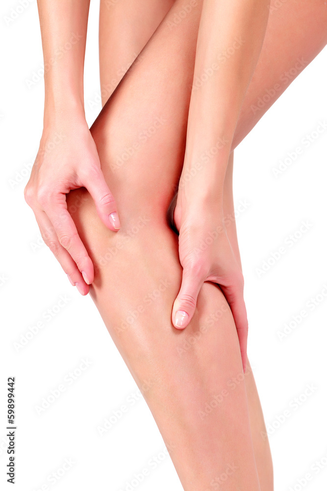 Woman holding sore knee, on white background Woman holding sore knee, on white background