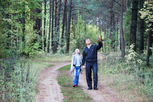 father and daughter in forest