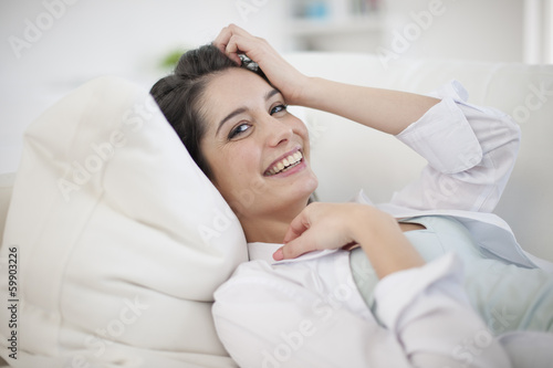 Gorgeous woman at home relaxing in living-room