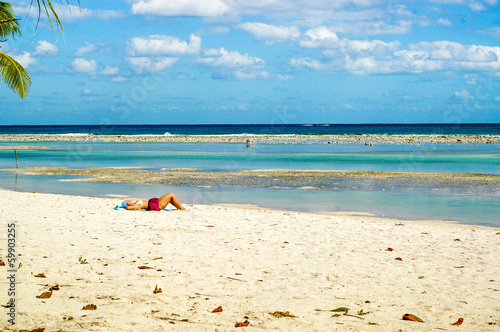 Sunbathing on a Caribbean beach by the sea