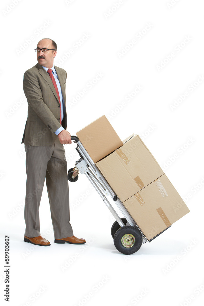 Businessman and handcart with a load Businessman and handcart with a load