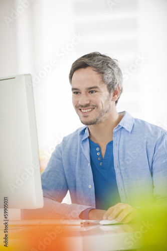 man in front of a computer