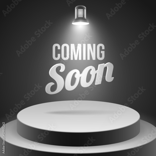Coming soon message illuminated with stage light