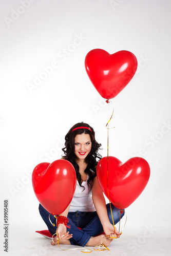 valentine's day beautiful young woman with red balloons