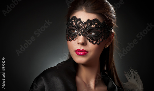 Portrait of attractive sensual young woman with mask