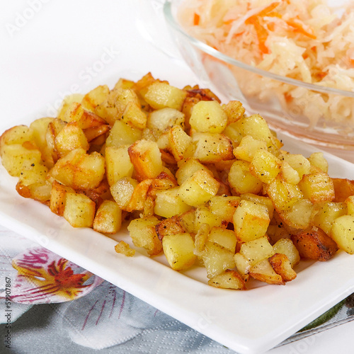 Fried potato cubes  with sour cabbage