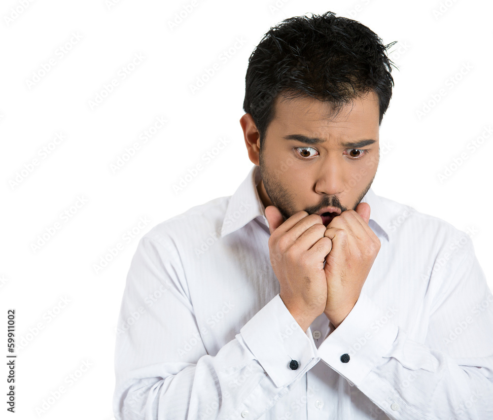 Scared, stressed, shy man biting his fingernails Scared, stressed, shy man biting his fingernails