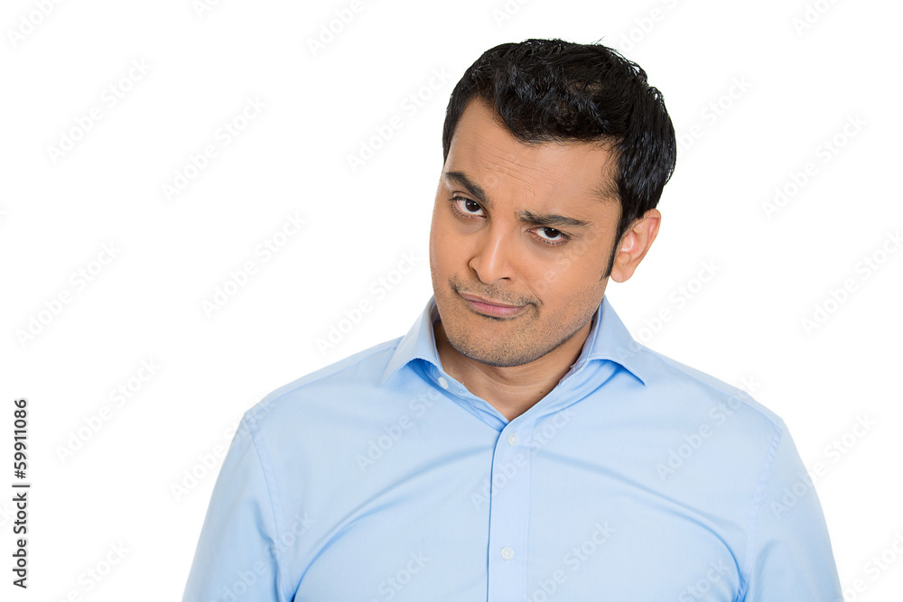 Skeptical, grumpy young business man, worker, boss Skeptical, grumpy young business man, worker, boss