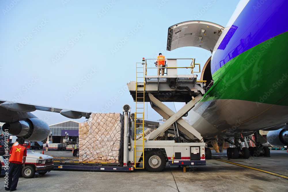 loading goods to cargo plane at airport - obrazy, fototapety, plakaty 