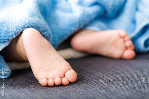 Baby feet with towel © leungchopan