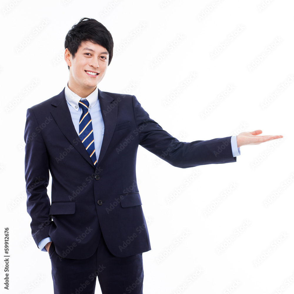 Young Asian business man showing something Young Asian business man showing something