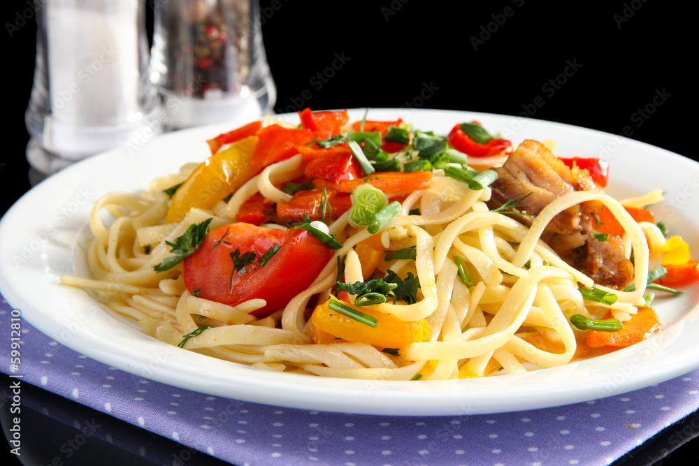 Noodles with vegetables on plate close-up Noodles with vegetables on plate close-up