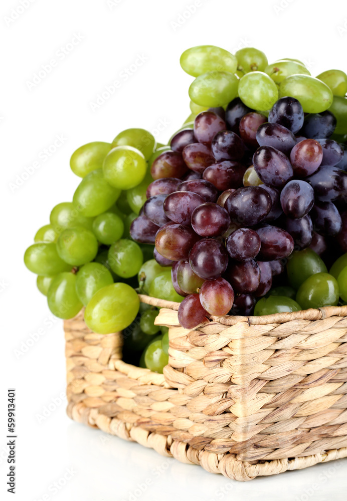 Ripe green and purple grapes in basket isolated on white Ripe green and purple grapes in basket isolated on white