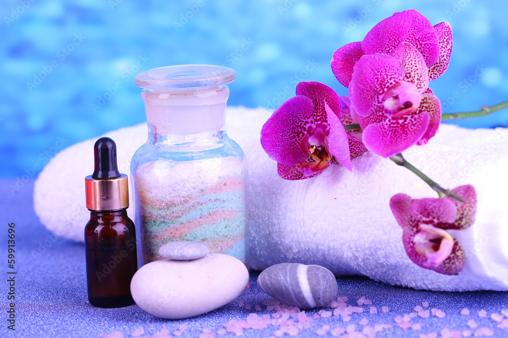 Beautiful spa setting with orchid on blue background Beautiful spa setting with orchid on blue background