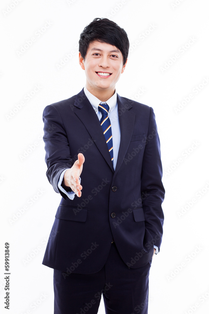 Young business man extending hand to shake