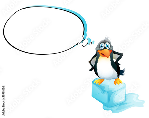 A penguin standing above an icecube