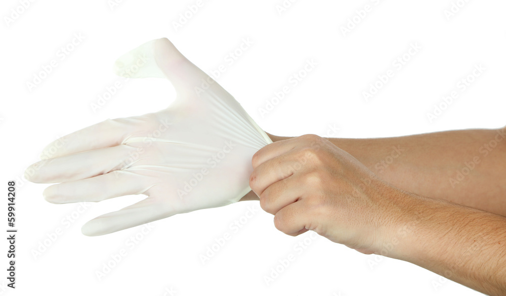 Doctor putting on protective gloves, isolated on white Doctor putting on protective gloves, isolated on white