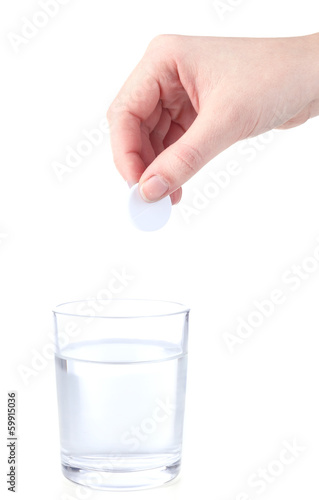 Glass with efervescent tablet in water with bubbles isolated photo