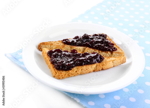 Delicious toast with jam on plate isolated on white