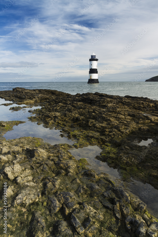 Penmon Beach, Anglesey, Wales with lighthouse.